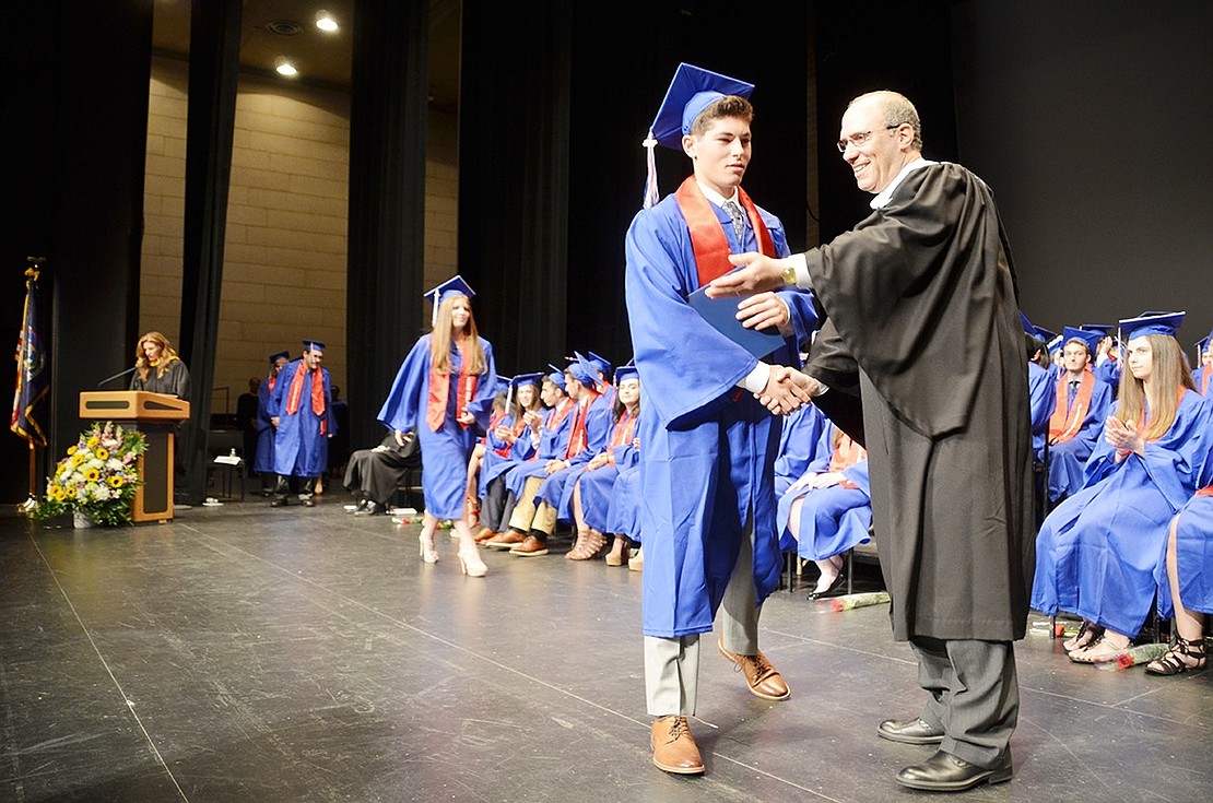 Jake Wynn leads the way as senior after senior is called to graduate. 