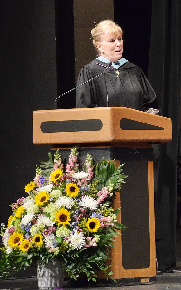 Pat Lambert addresses “her” class. She’s moved up schools with this class and has been their principal since she joined the district, so sending them off to college was a proud moment for her. 