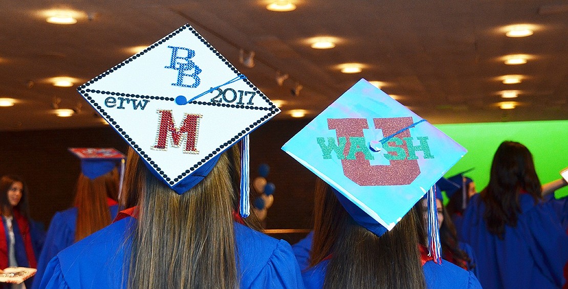 Emily Wexler and Meredith Berger show off their decorated caps. The pair are going to Manhattanville College and Washington University, respectively 