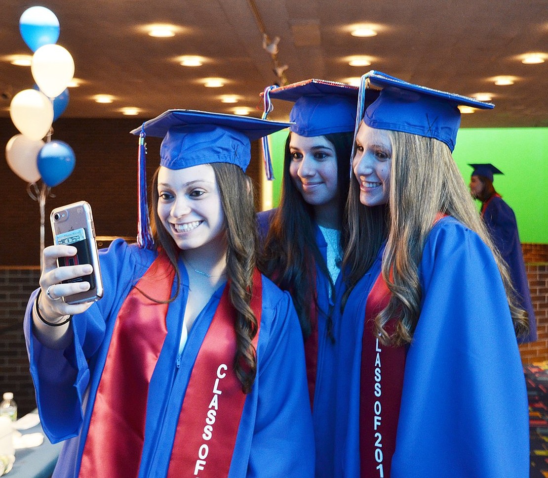 A moment we’ll always remember: Rachel Brown, Sydney Goodman and Erica Wels solidify their graduation with a selfie. 