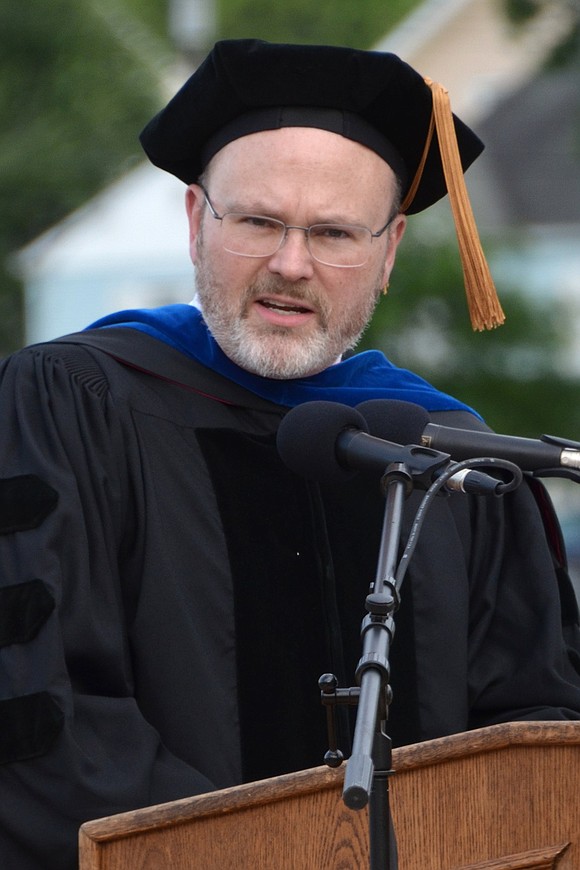 Principal Dr. Mitchell Combs draws from Dr. Seuss and recites his own rhyming verse for the graduating seniors.