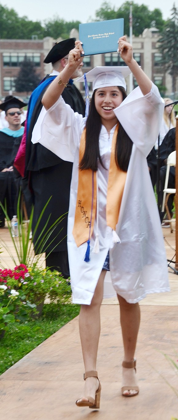 Christina Chumpitazi cannot contain her delight after receiving her diploma.