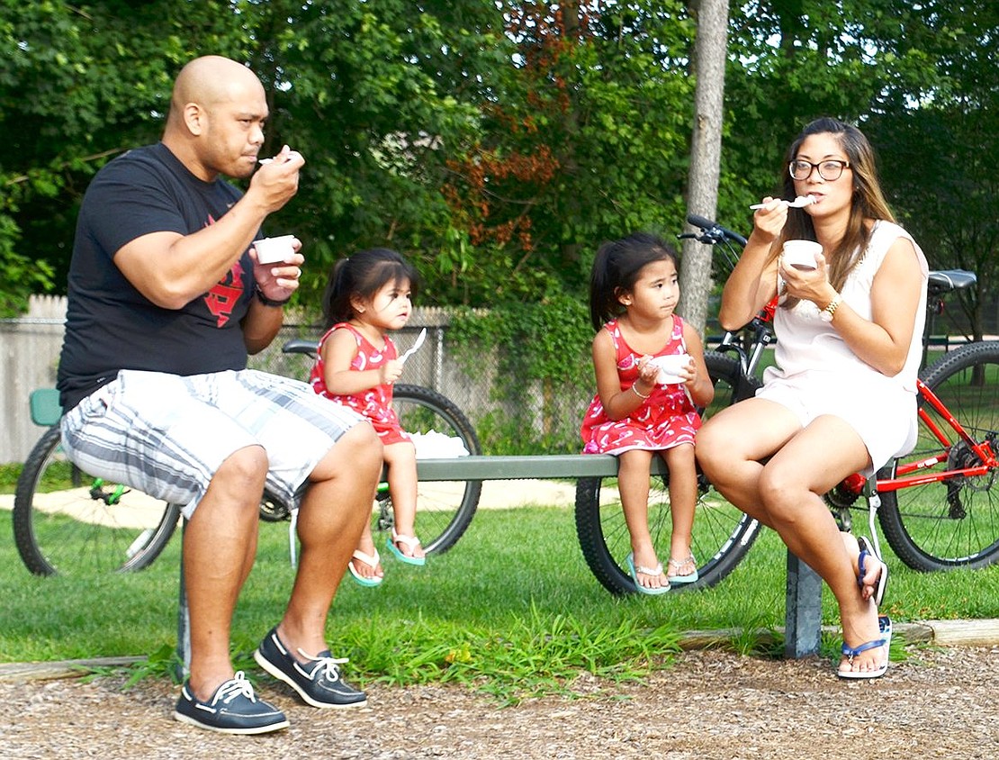 Free ice cream? Sounds like a good night out to the Gutierrez family. From left are Sylvester, 2-year-old Arabella, 3-year-old Vivienne and Taylor. 