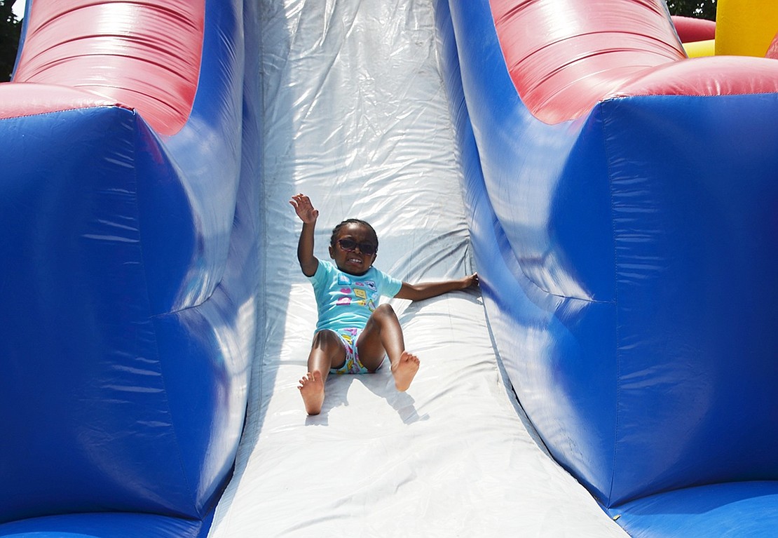 Unity Day isn’t just for Port Chester residents. Seven-year-old June Joseph of Yonkers tumbled down the inflatable slide time and time again. 