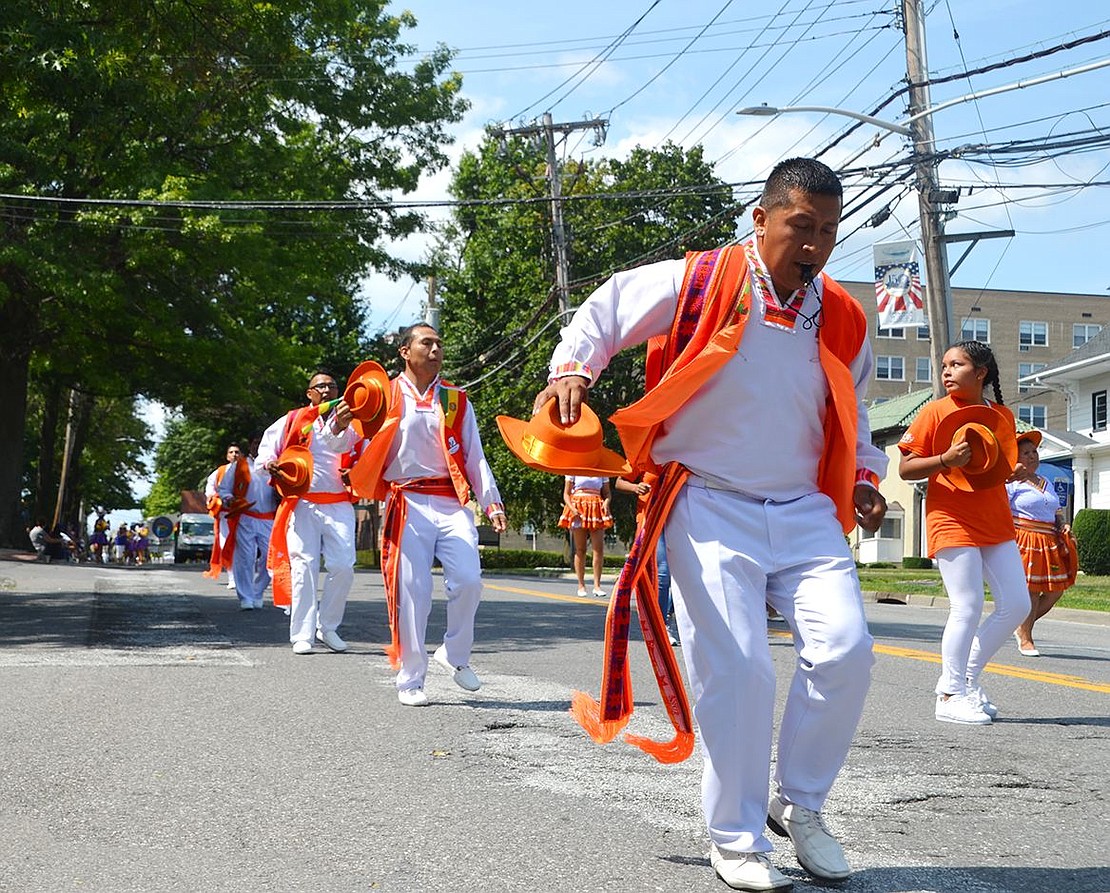 Dancers of all ages and talents embrace their culture, including those from Fraternidad Folklorica Y Cultural out of Orange, N.J. Leading the pack is Juan Mamani.