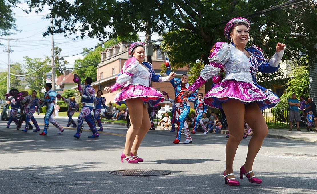 Westchester Avenue shines as sequined dancers reflect the bright sunlight. These ladies are from Fraternidad Folklorica Cultural Caporales Universitarios de San Simón out of Bloque, N.Y. 