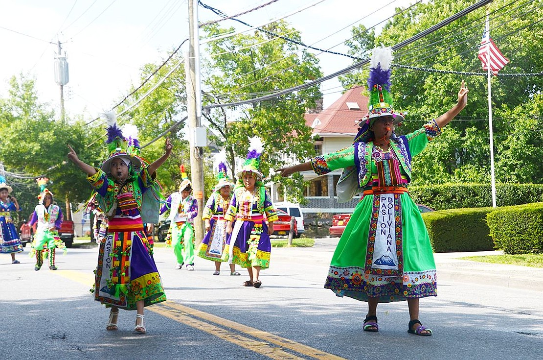 Pasion Boliviana dancers are decked out in neon green attire. 