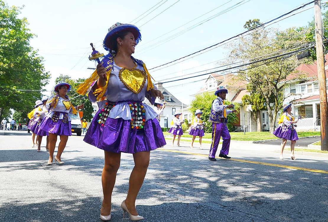 Marcela Valdez of Port Chester smiles happily as she represents Kullaguada Bolivia.