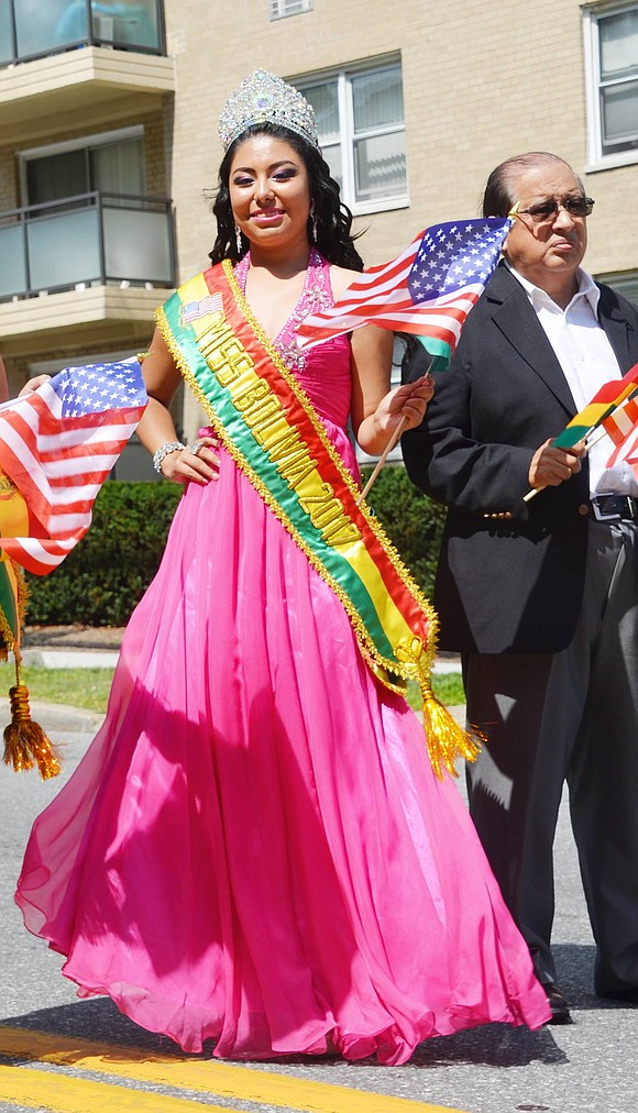 Miss Bolivia 2017 Karla Clares of Orange, N.J., representing Centro Cultural Bolivia, poses for a picture on her way down Westchester Avenue.