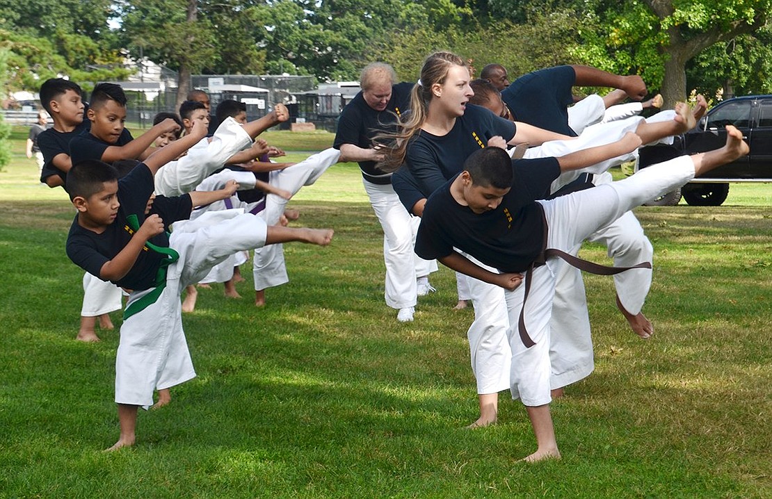 Students in Rico Dos Anjos’ karate classes demonstrate their skills. 