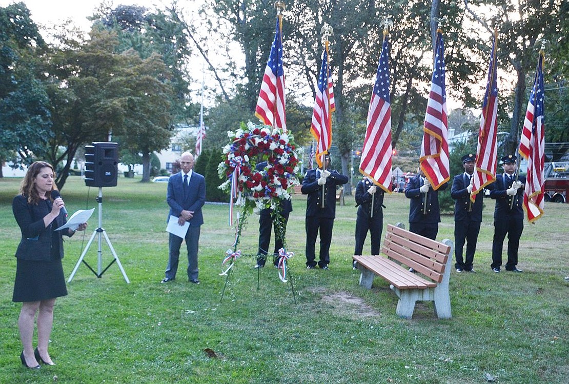 With the Port Chester Fire Department posting colors, emcee Port Chester Trustee Frank Ferrara and a memorial wreath in the picture, Rabbi Jaymee Alpert of Congregation Kneses Tifereth Israel gives the invocation at the 9/11 Remembrance Ceremony in Lyon Park on Monday. It marked the 16th anniversary of the terrorist attacks that killed almost 3,000 people in New York City, Washington, D.C. and Somerset County, Pa.