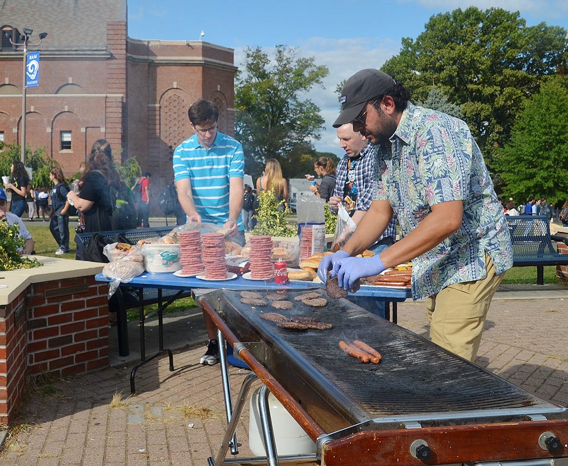 Fresh burgers and hotdogs sizzle and fill the flagpole plaza with an enticing smoky smell. 