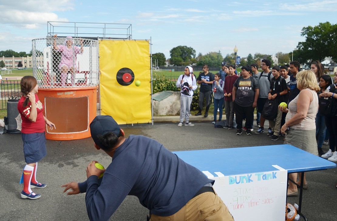 Port Chester High School senior Kevin Mendosa dunks Peggy Conway during the PCHS Carnival on Friday, Sept. 29. The event, which was sponsored by the environmental club, raised about $4,250 for Hurricane Irma, Maria, and Harvey victims. Administrators and event coordinators are deciding how to split up the donations and what charities should receive them.