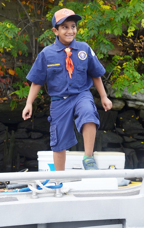 Valley Terrace resident Arvin Kovoor, 7, is nothing but smiles as he steps onto the Coast Guard Auxiliary boat. 