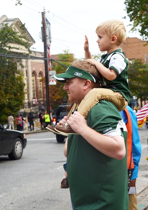 Washington Mews 3-year-old Brian Malin has the best view in town – on top of his father Tim’s shoulders.