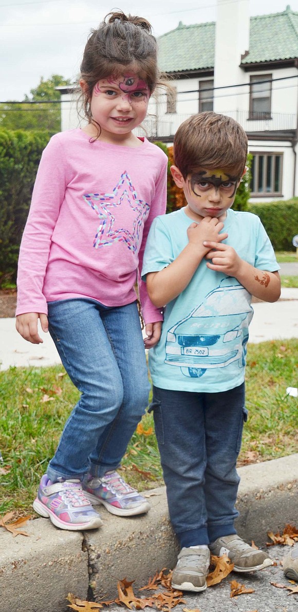 With painted faces, Batman and ‘My Little Pony’ fans Jillian, 5, and John Gasparini, 3, of Rye Brook enjoy the parade. 