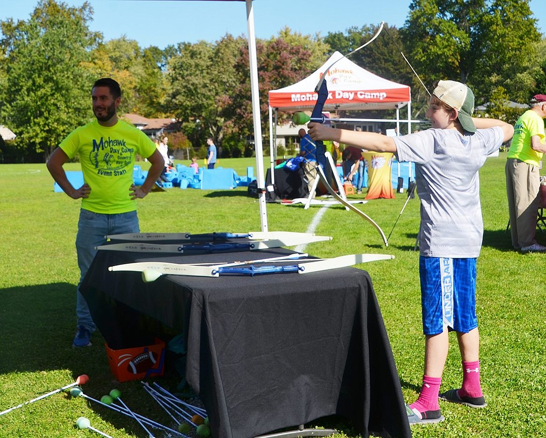 Blind Brook Middle School seventh grader William Luceno tries his hand at archery. 