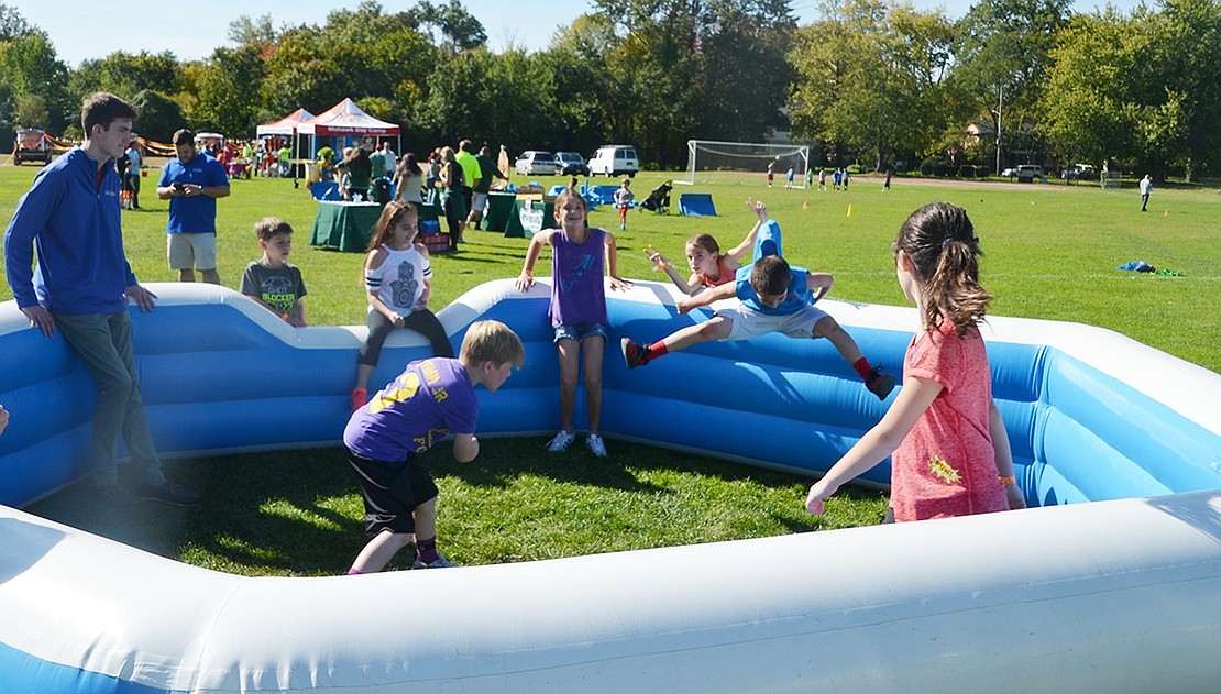 A group of kids tries to dodge the ball before it hits them in an intense game of Gaga Ball. 