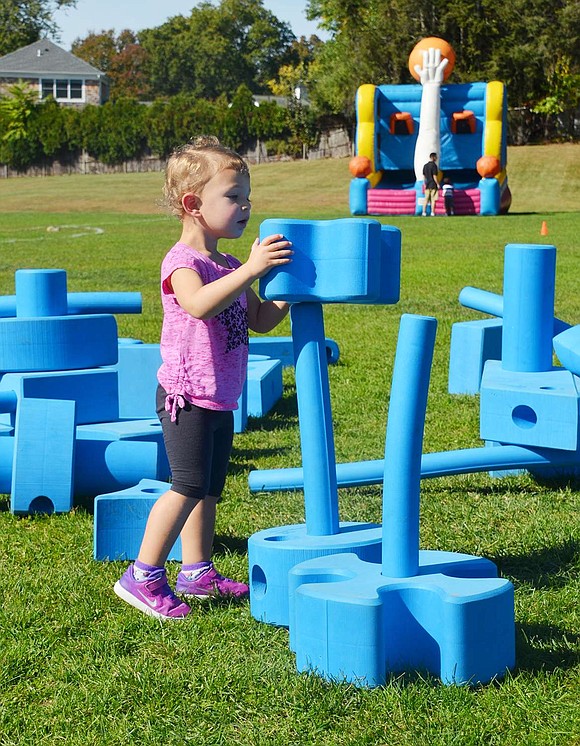 An engineer in the making, 2-year-old Peyton Cohen spent the day stacking, connecting and placing giant blocks. 