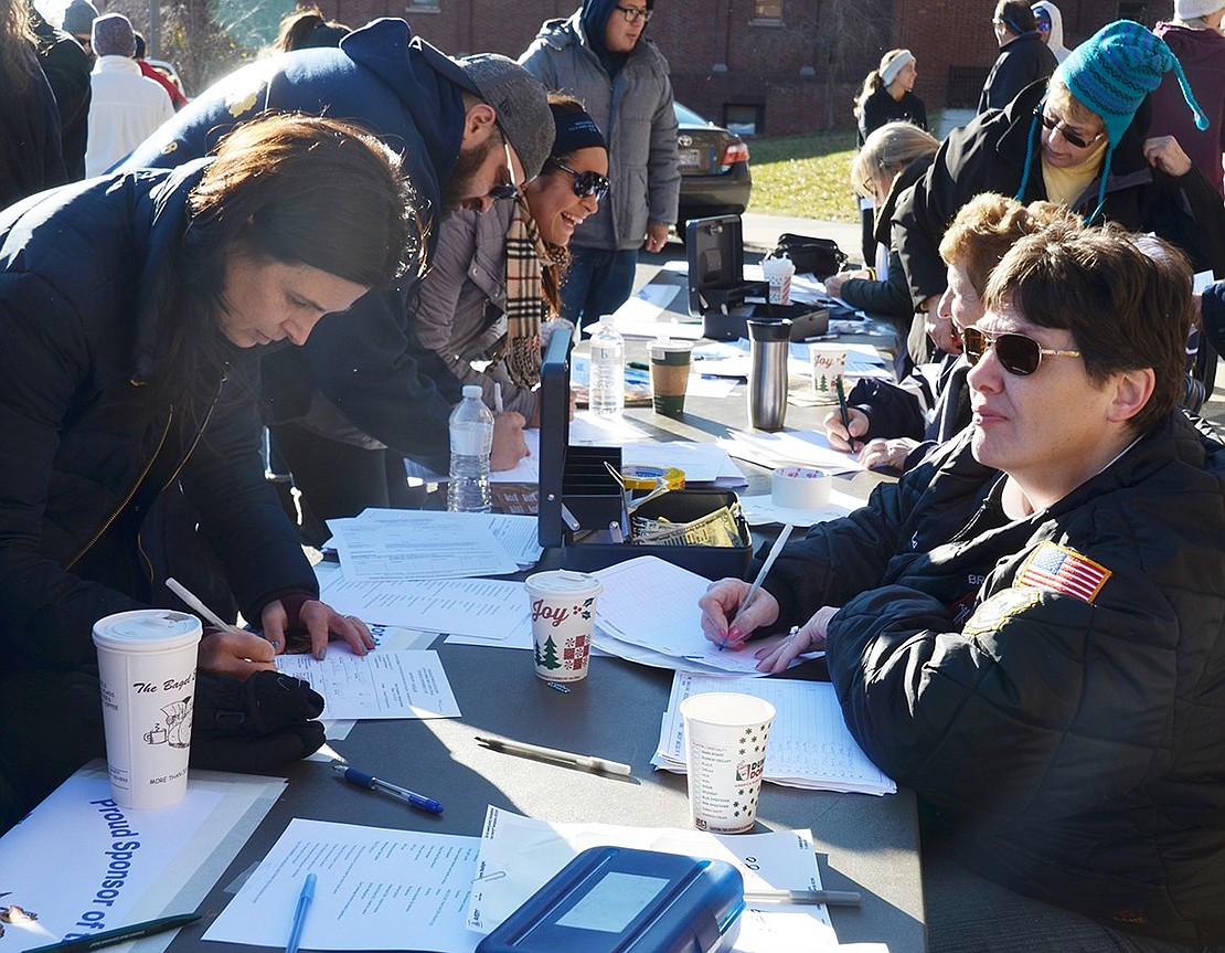 Runners register for the Tamarack Tower Foundation Thanksgiving Day Turkey Trot.