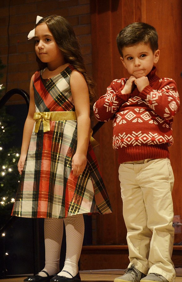 Talia Aiello is pretty serious while Tyler Milano is a little silly before their kindergarten performance.