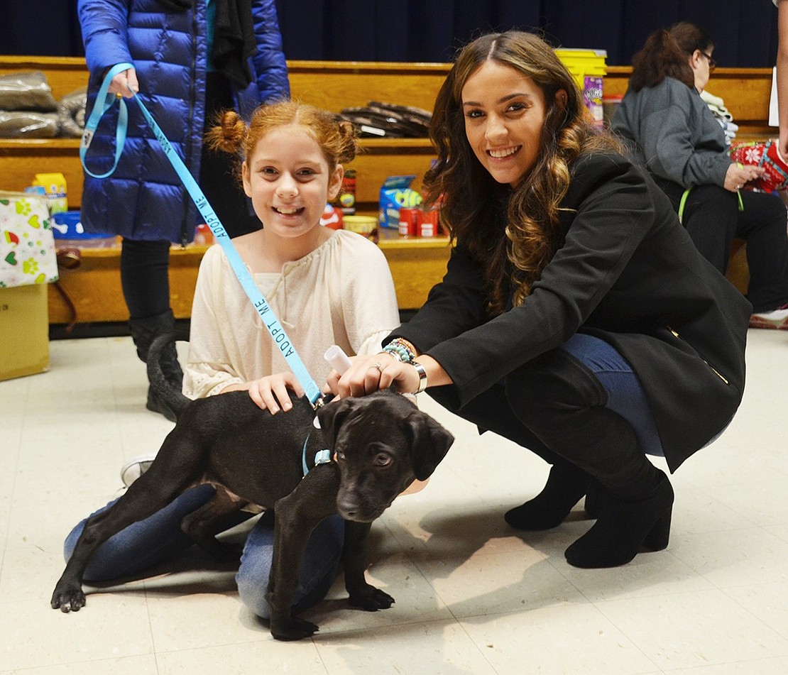 Xiomara Moore, a sixth-grader, and Giovana Tieni, a psychology intern at the middle school, fell in love with Tommy, a 3- to 4-month-old Black Lab. 