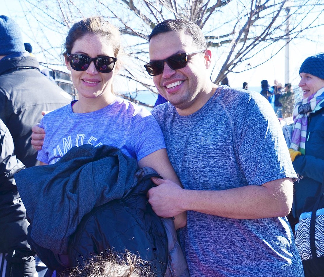 Everyone has different ways of preparing for the frigid water. Alison and Andres Oquendo of Rye wear T-shirts to adjust their bodies to the 16-degree Fahrenheit weather.