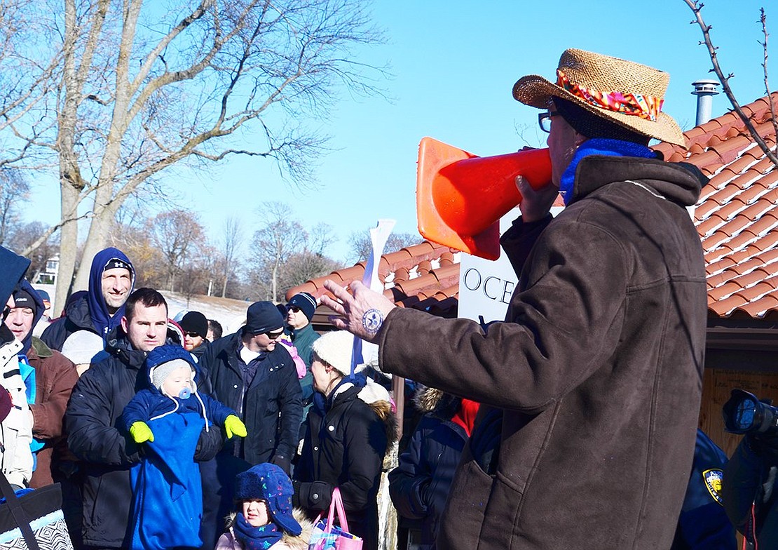 Phil Gormley, a Polar Bear Plunge originator, announces the plunge instructions and beneficiaries to participants. This year, along with MAC Angels Foundation and Challenged Athletes Foundation, event proceeds are going to two new charities: Soul Ryeders and the Outreach Resurrection Committee.