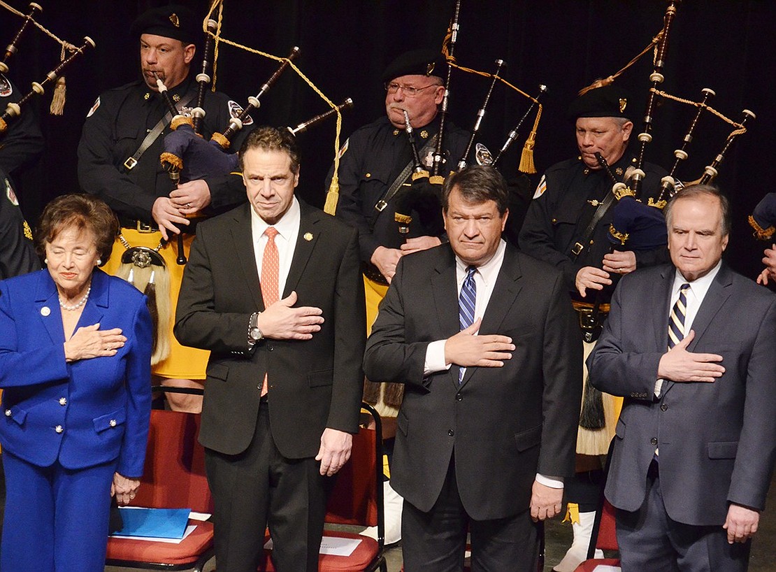 Sunday’s ceremony was filled with pomp, circumstance and bagpipers from the Pipes and Drums of the Police Emerald Society of Westchester. From left holding their hands over their hearts while the pipers play are Congresswoman Nita Lowey, who served as MC, Gov. Andrew Cuomo, George Latimer and County Clerk Timothy Idoni.