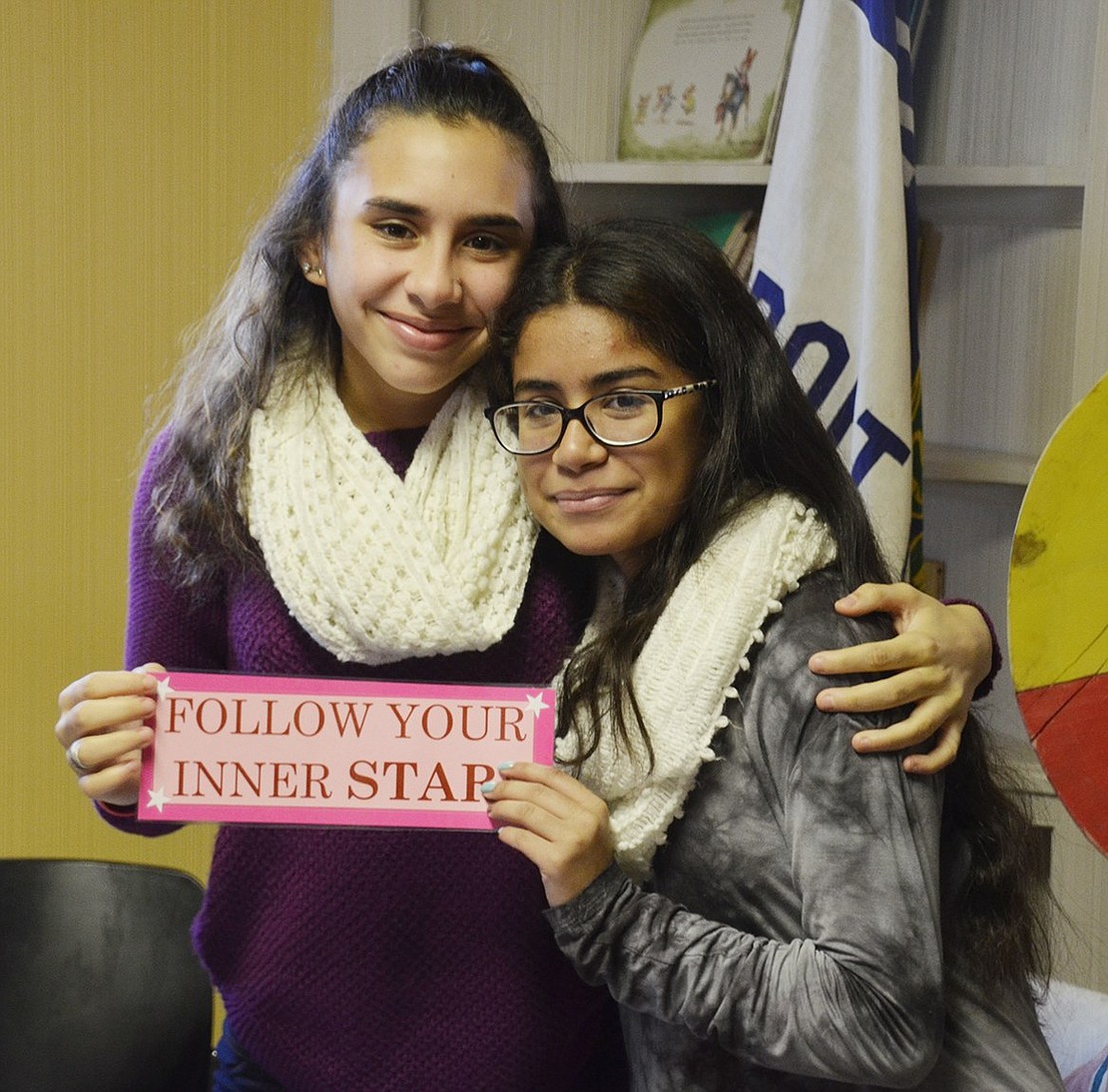 Port Chester Middle School 13-year-olds Angelina Aguirre (left) and Nicole Aguilar remind the younger ladies to “Follow your Inner Star.” Older Girl Scouts worked all morning to run the tea party.