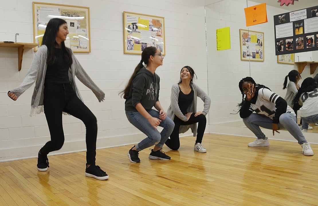 Port Chester High School sophomore Lia Jade (right), Mireya Gudino, age 12, Marilyn Yaguana, age 13, and Kimberley Lozano, age 12, strike a final pose at the end of a hip-hop routine they choreographed themselves in the movement studio. 