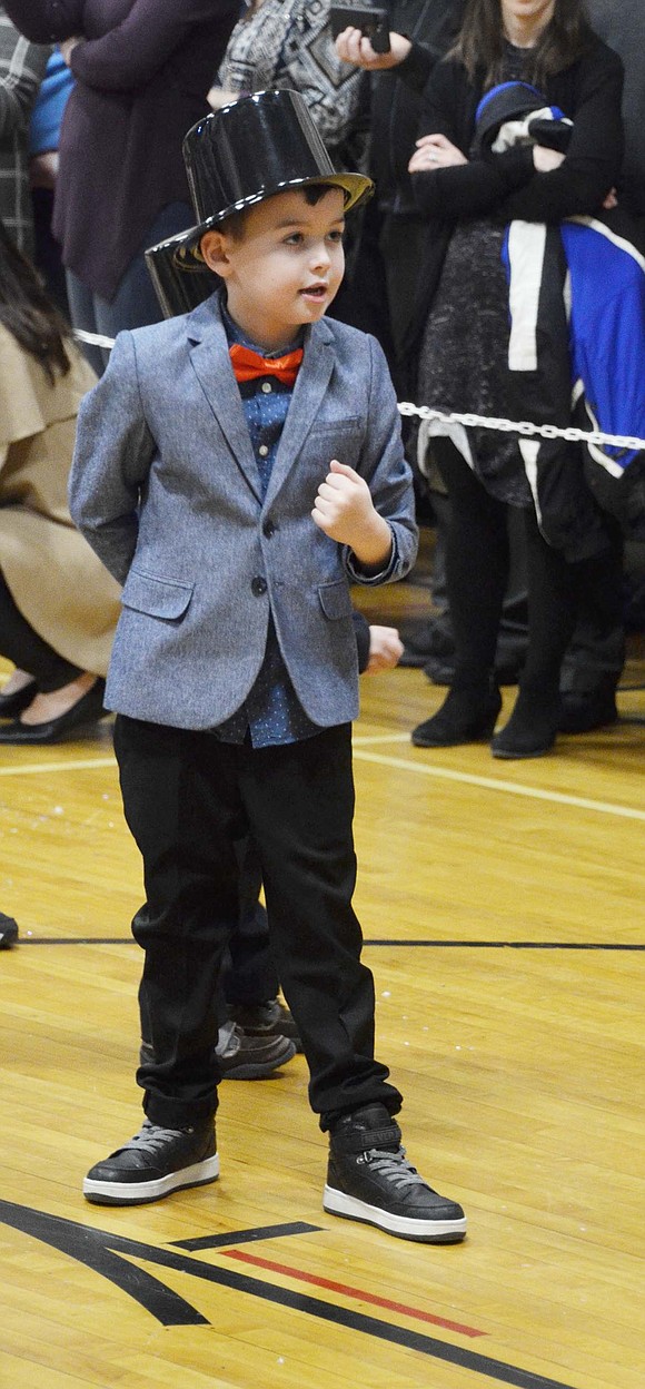 Lucas DeBari strikes a dapper pose while singing and dancing to “Frosty the Snowman.”