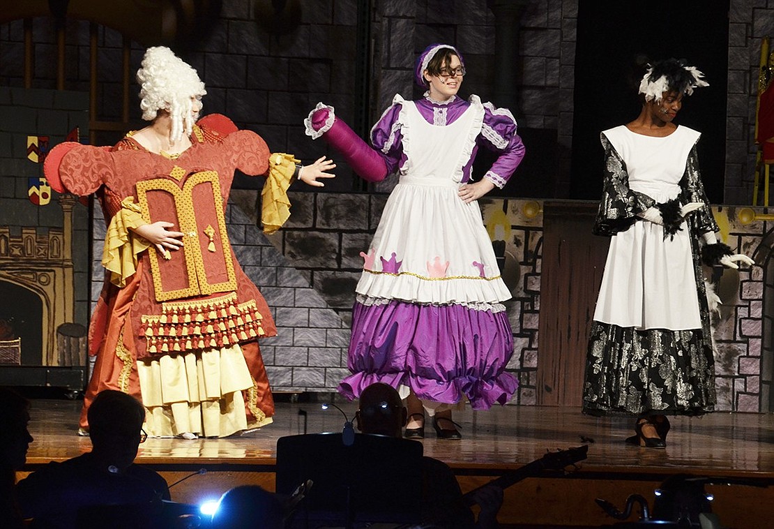 Babette the feather duster, played by Sanai Ash, Mrs. Potts, played by Sophia Kamensky, and Madame De La Grande Bouche the wardrobe, played by Alexa Tomassetti, sing and dance about desiring to be human again. 