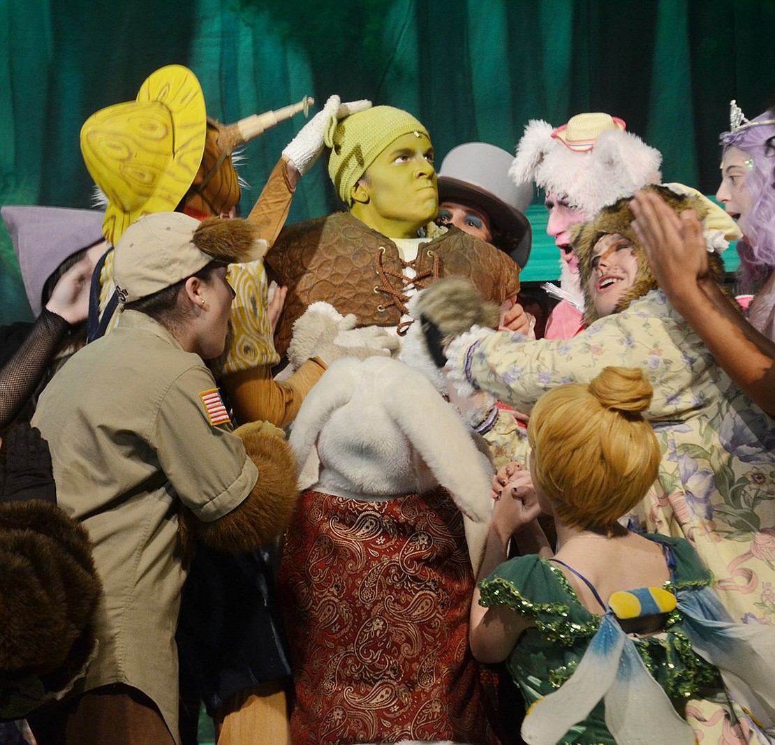 After a cluster a fairytale characters bombard Shrek (played by Michael Lieberman) at his swamp, he’s annoyed by their pleas to help them return home. 