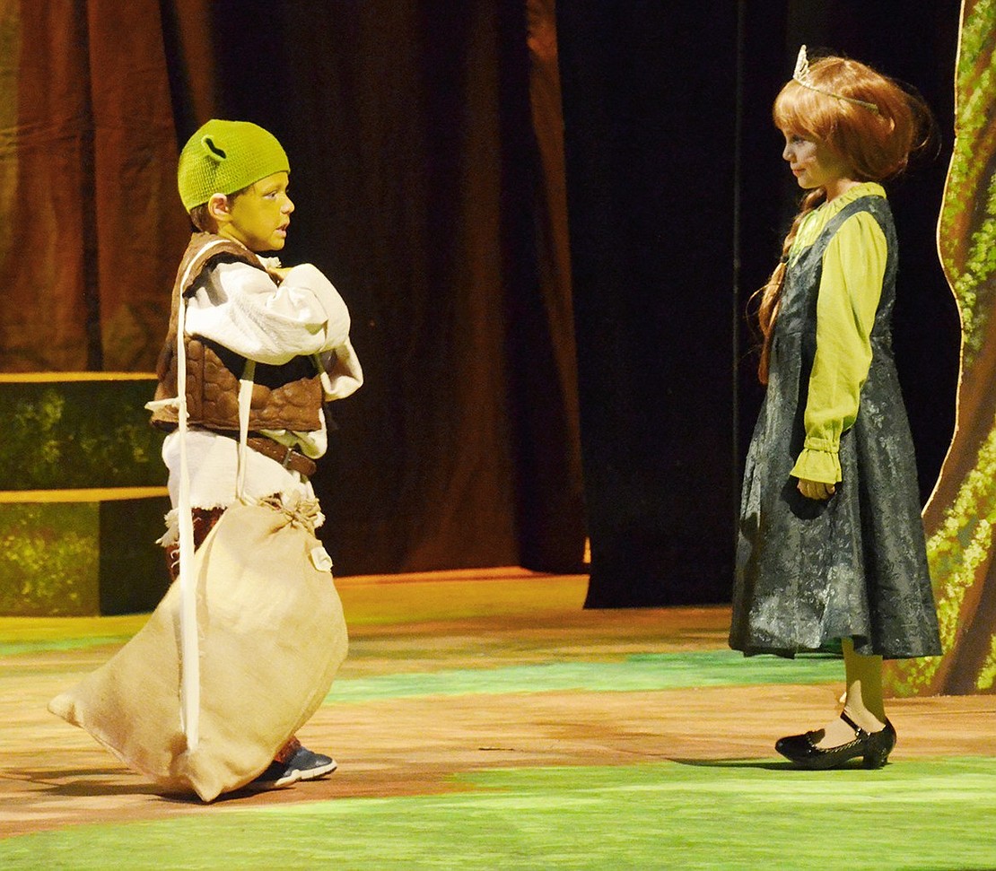 A young Shrek (played by Noah Lupow) and Fiona (played by Samantha Beadle) briefly meet while their backstories are explained. 