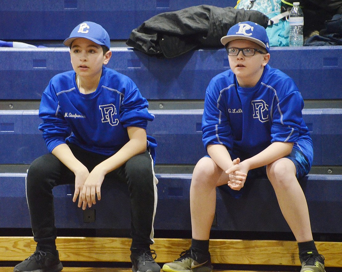 High School freshmen Gavin LaDore (right) and Michael Gianfransico watch their fellow “Kent Murphy Baseball Academy” teammates bat with intensity.