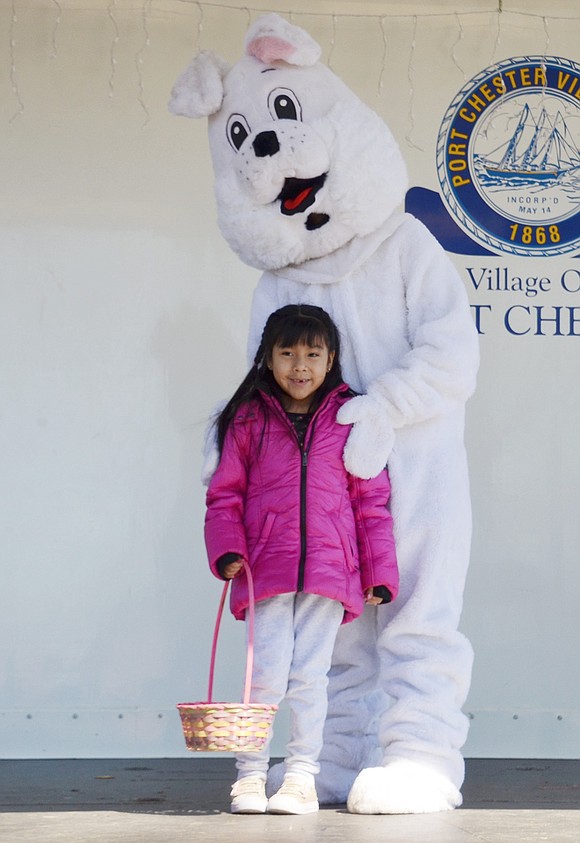 Port Chester resident Shirley Tintaya, a 6-year-old at JFK Elementary School, is so excited to meet the Easter Bunny, played by Grant Street resident Dawn DeLeo.