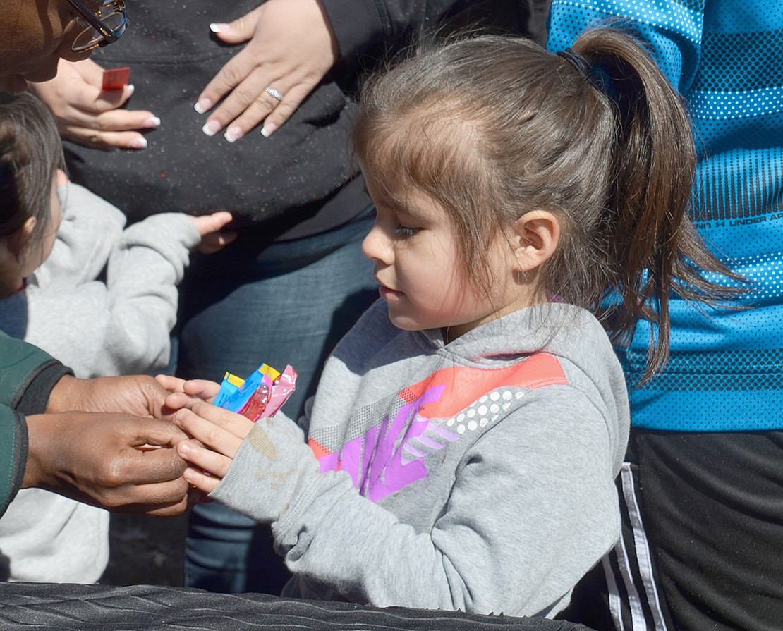 Easter is all about the candy. After spinning a carnival roulette wheel, 5-year-old Edison Elementary School kindergartner Yazelia Barros collects her reward.  