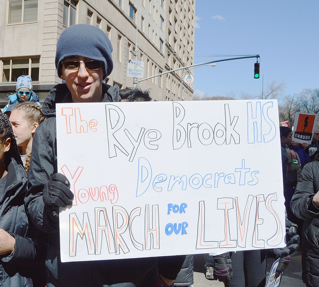 Blind Brook High School sophomore Abe Baker-Butler holds up his sign during the Walk for Our Lives in New York City on Saturday, Mar. 24. Baker-Butler is president of the Rye Brook High School Young Democrats.    Noah Zeitlin|Westmore News 