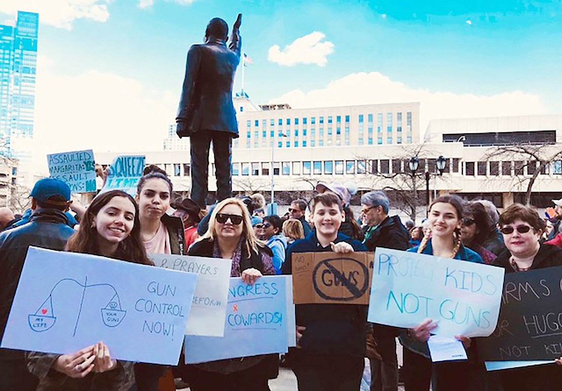 Port Chester High School students and family find a spot to post up and flash their protest signs in the middle of a crowd of hundreds during the March for Our Lives in White Plains on Saturday, Mar. 24. From left: Evie Tarascio, 14, Brianna Ayala, 16, Gina Tarascio, Thomas Tarascio, 14, Sara Tarascio, 16, and Marisa Ayala.  Courtesy of Gina Tarascio 