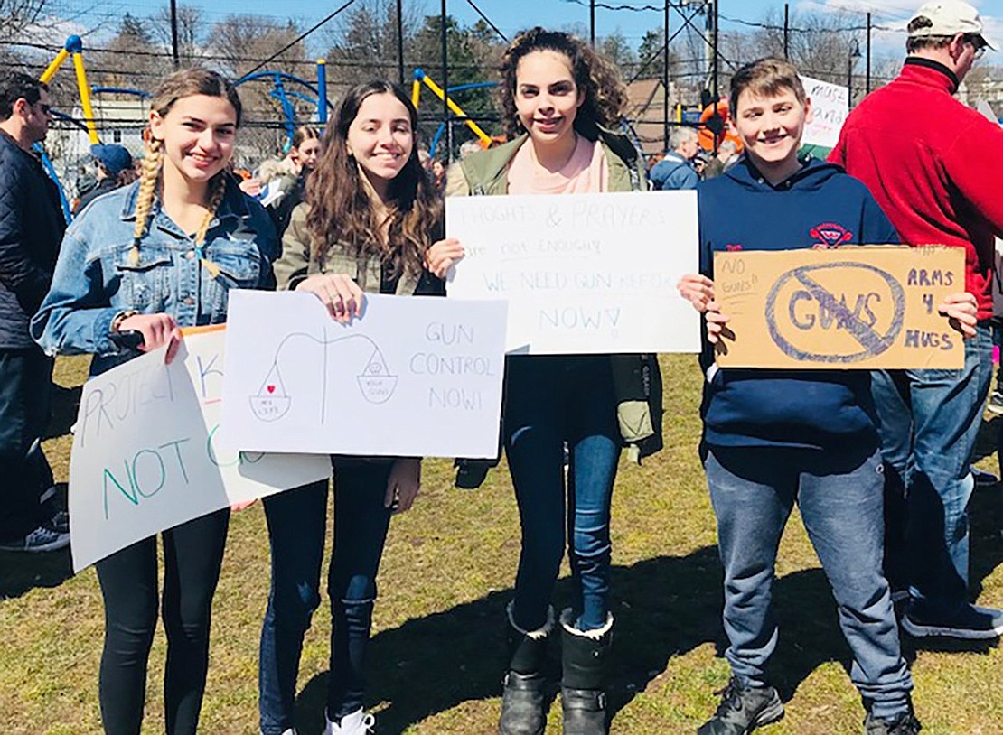 With signs in hand calling for gun control, Sara Tarascio (left), 16, Evie Tarascio, 14, Brianna Ayala, 16, and Thomas Tarascio, 14, are eager to let their voices out at the march.  Courtesy of Gina Tarascio 