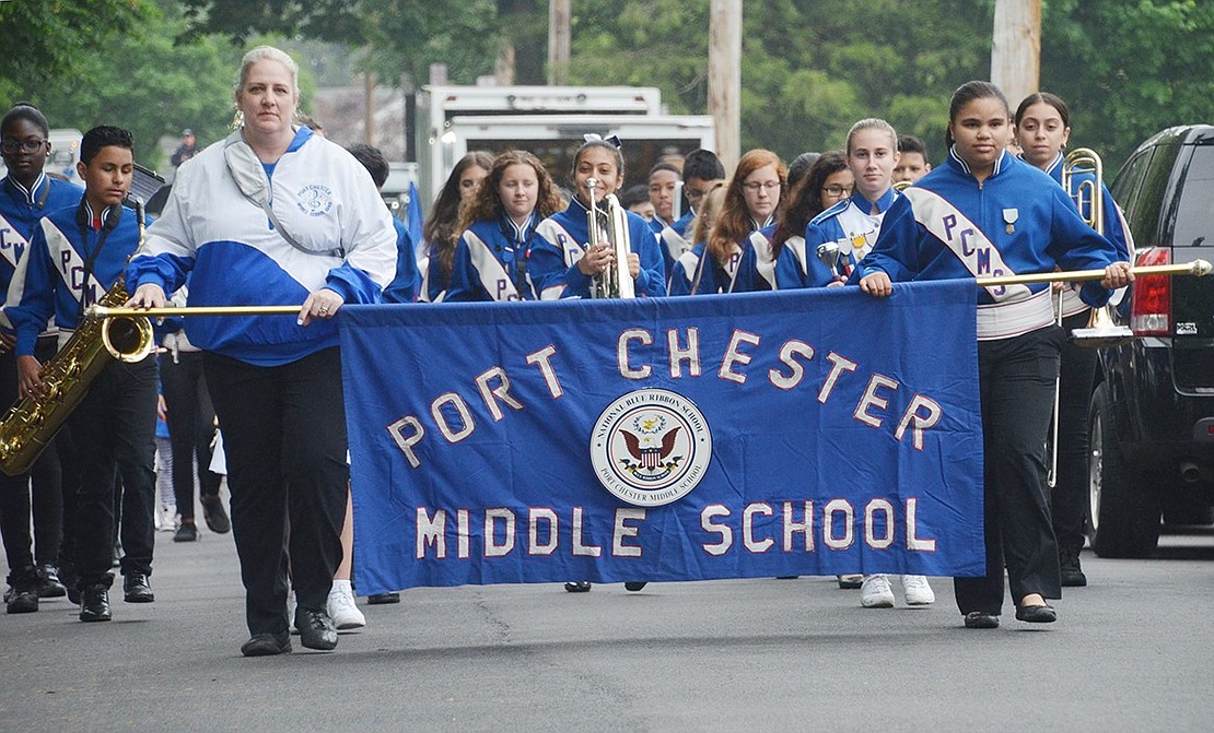 Port Chester Middle School Band instructor Linda McDermott and seventh-grader Stephanie Lazala lead the marching band in a loop around Lyon Park to make a grand entrance at PC150FEST on Sunday, May 27. 