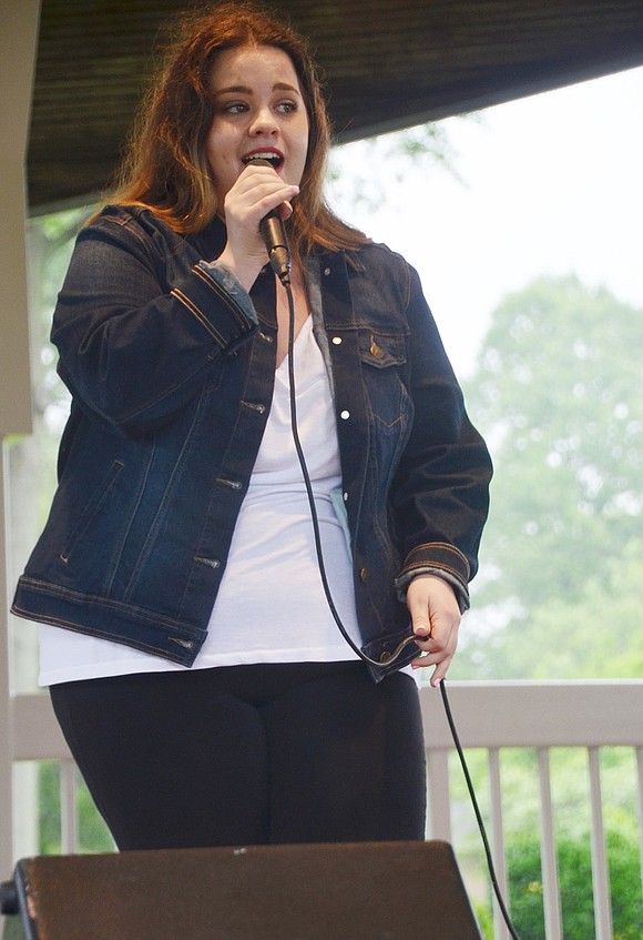 To kick off the festival with local talent, Adams Avenue resident Rosie Veltri, 23, passionately sings “At Last.” 