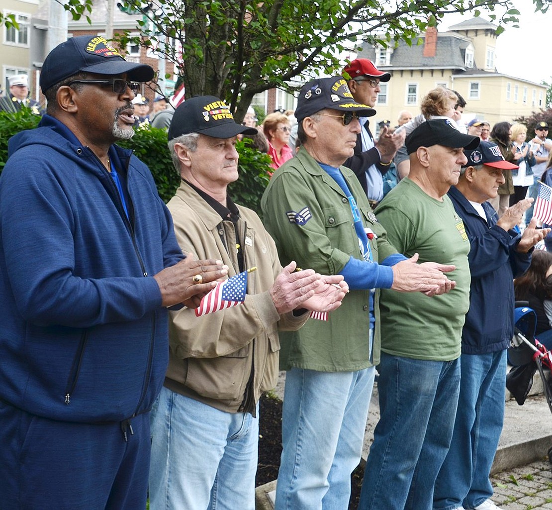 Port Chester and Rye Brook veterans Fred Griffin, Steve Vespia, Marvin Goldowsky, Peter Sileo and Dominick Mancuso applaud during the ceremony at Veterans’ Memorial Park at the corner of Westchester Avenue and North Regent Street.