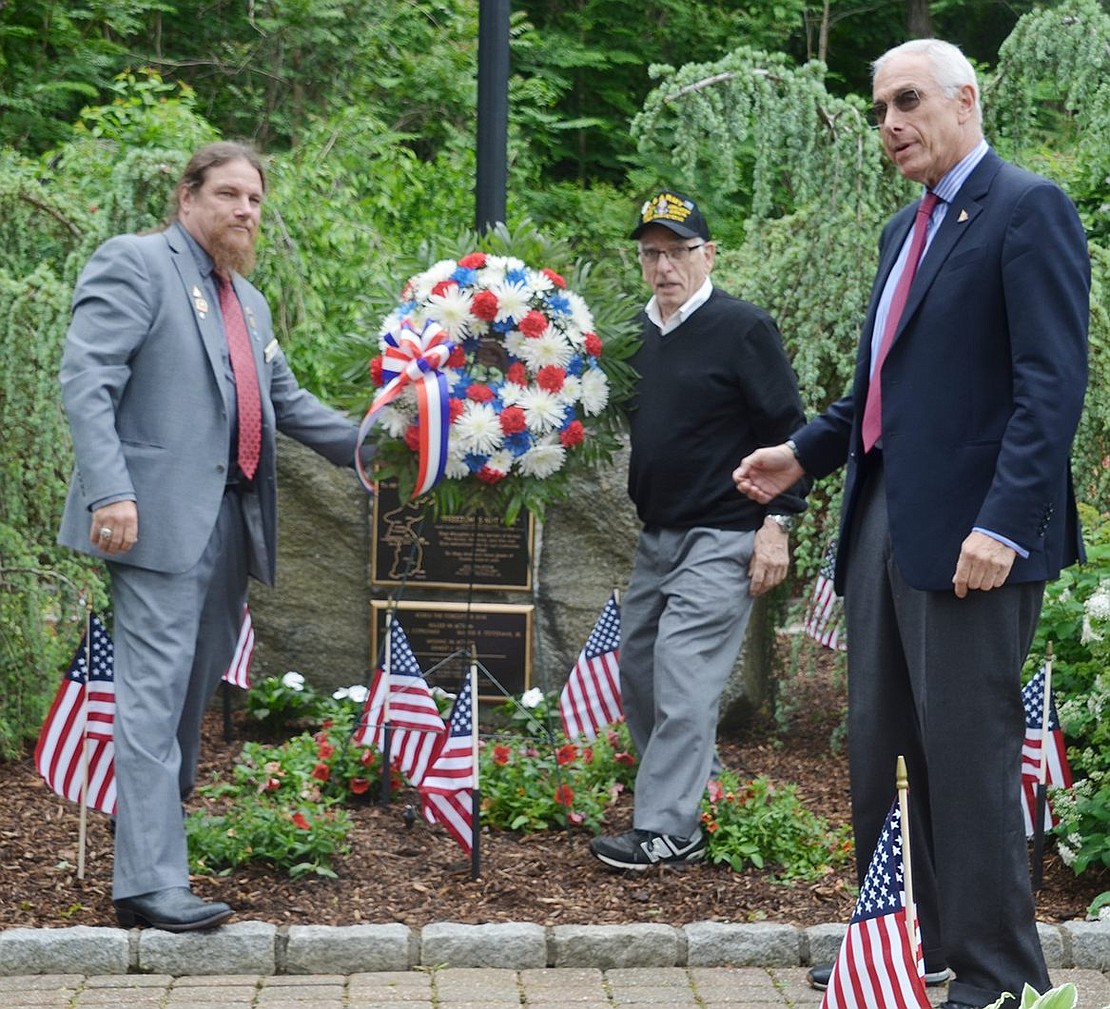 Rye Town Councilman Tom Nardi and Korean War veteran Silvio Buccieri place the memorial wreath at the Korean War memorial in Crawford Park as Rye Town Supervisor Gary Zuckerman looks on. In attendance was Patricia DeLuca, sister of Anthony Joseph Cotroneo, whose name is on the memorial plaque at the site. He died at age 19 on Nov. 1, 1951. “I’ll never forget it,” she said.