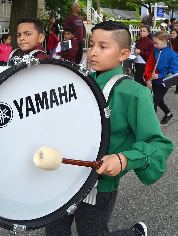 Edison School fifth grader Eliot Gamboa plays bass drum in the Memorial Day parade as part of the All-Elementary School Band.