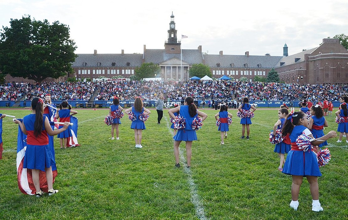 With hundreds of eyes spectating, the Park Avenue Elementary School cheerleading squad prepares to take to the Port Chester High School football field during Band Night on Wednesday, June 6. The showcase featured the final performance of the year for all Port Chester School District marching bands and elementary cheerleading groups.   