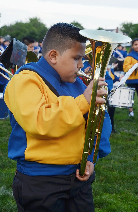 John F. Kennedy fourth-grader Jesus Hernandez plays his baritone while intensely focusing on the sheet music. 