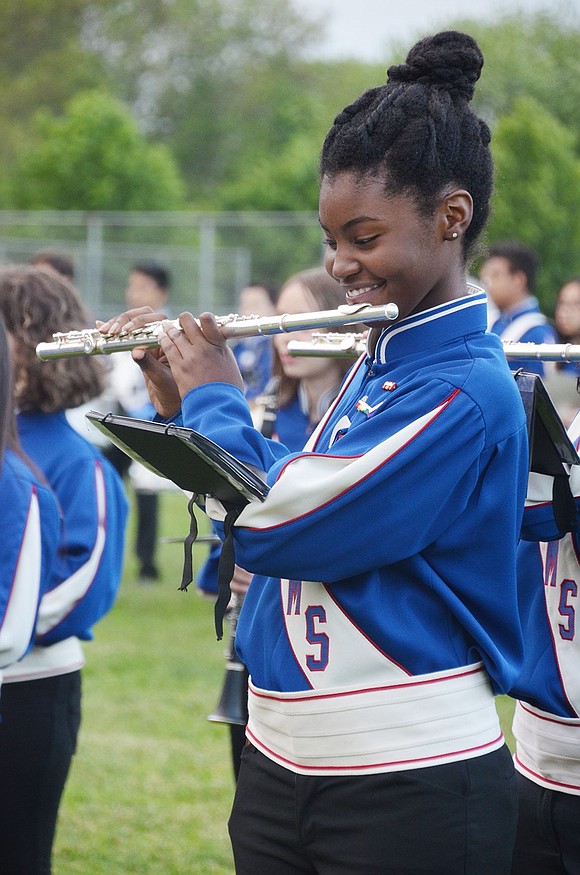 Port Chester Middle School eighth-grader Sanai Ash lets a smile out while playing the flute.