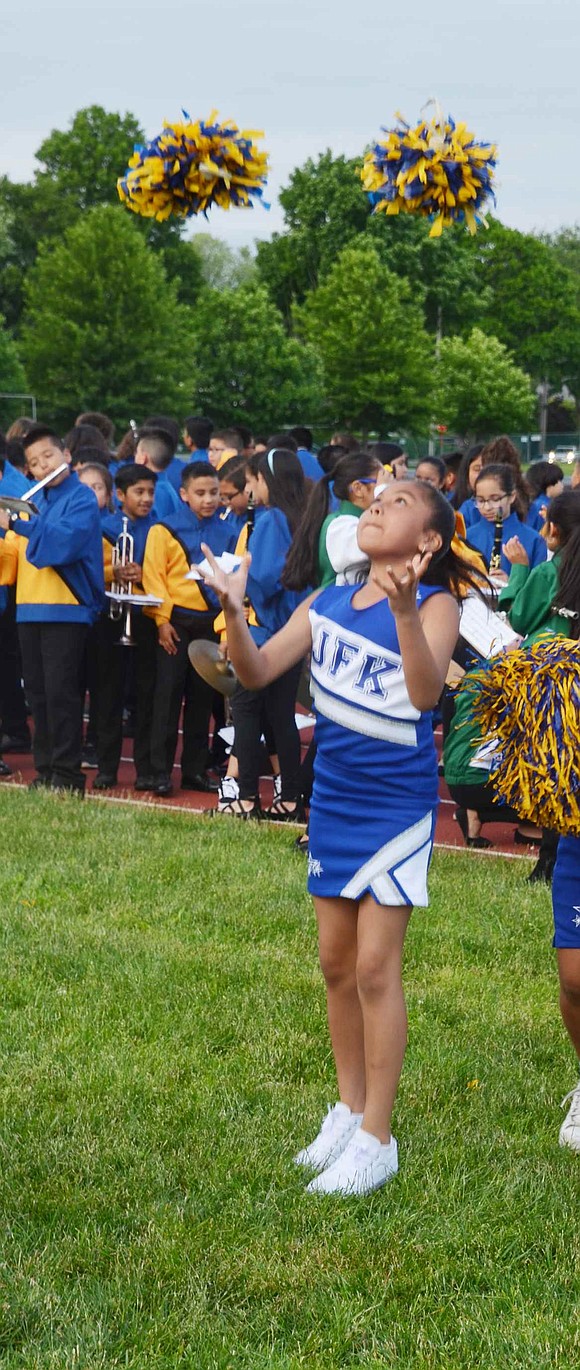 Practice makes perfect! John F. Kennedy fourth-grader Alexa Aguiriano practices throwing her pom-poms in the air so she doesn’t miss during the show.  